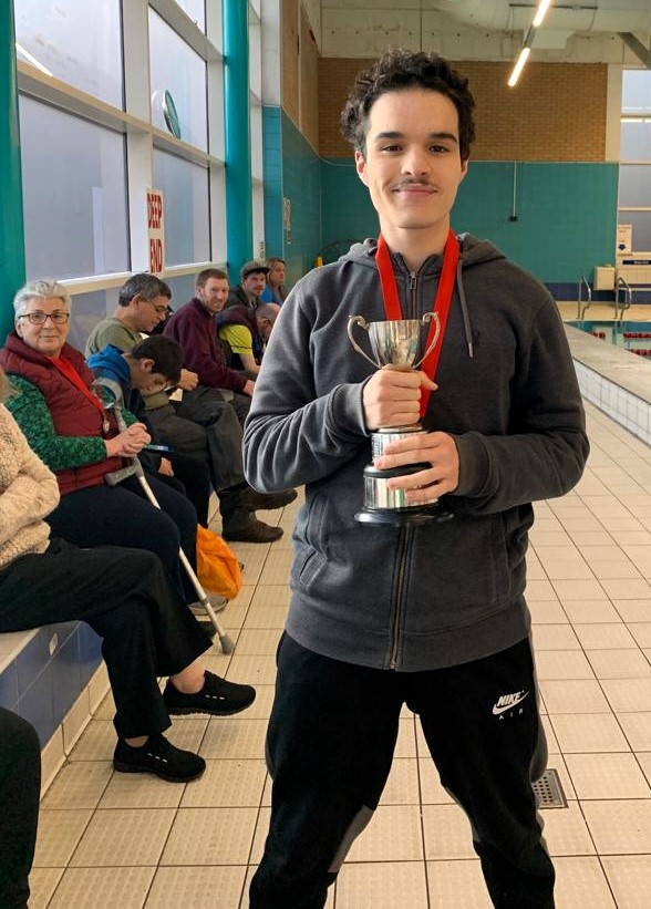 Salas with his trophy and our team behind
